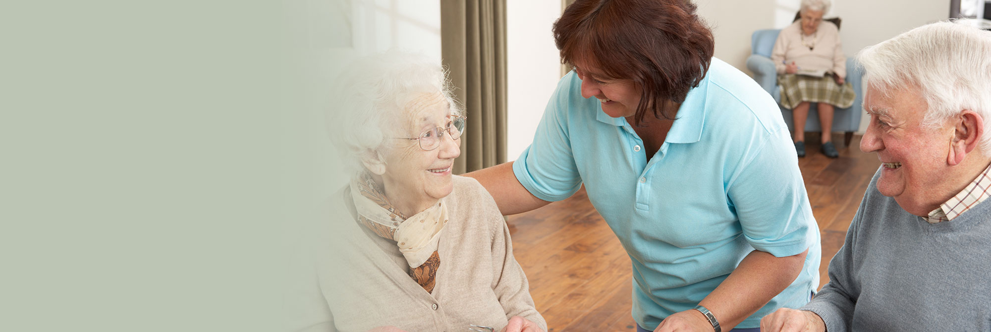 Elderly Couple Consulting with Nurse